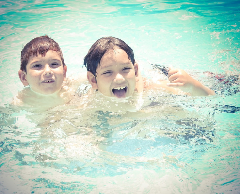 children playing in a pool