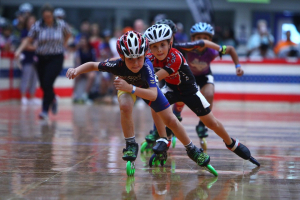 kids speed skating at a roller skating rink