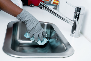 sink being cleaned