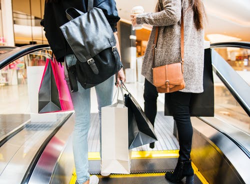 Shoppers on an escalator