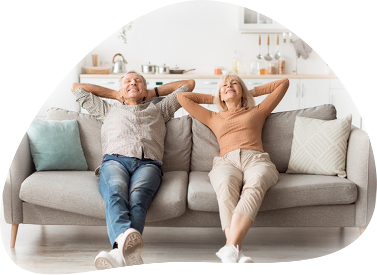 Smiling couple relaxing on couch
