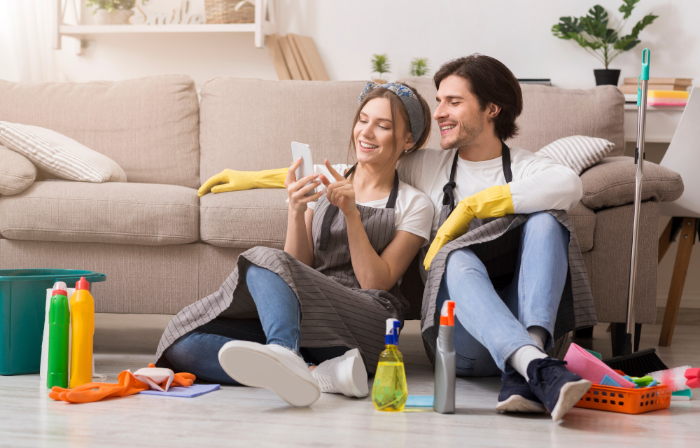 Couple taking a break from cleaning